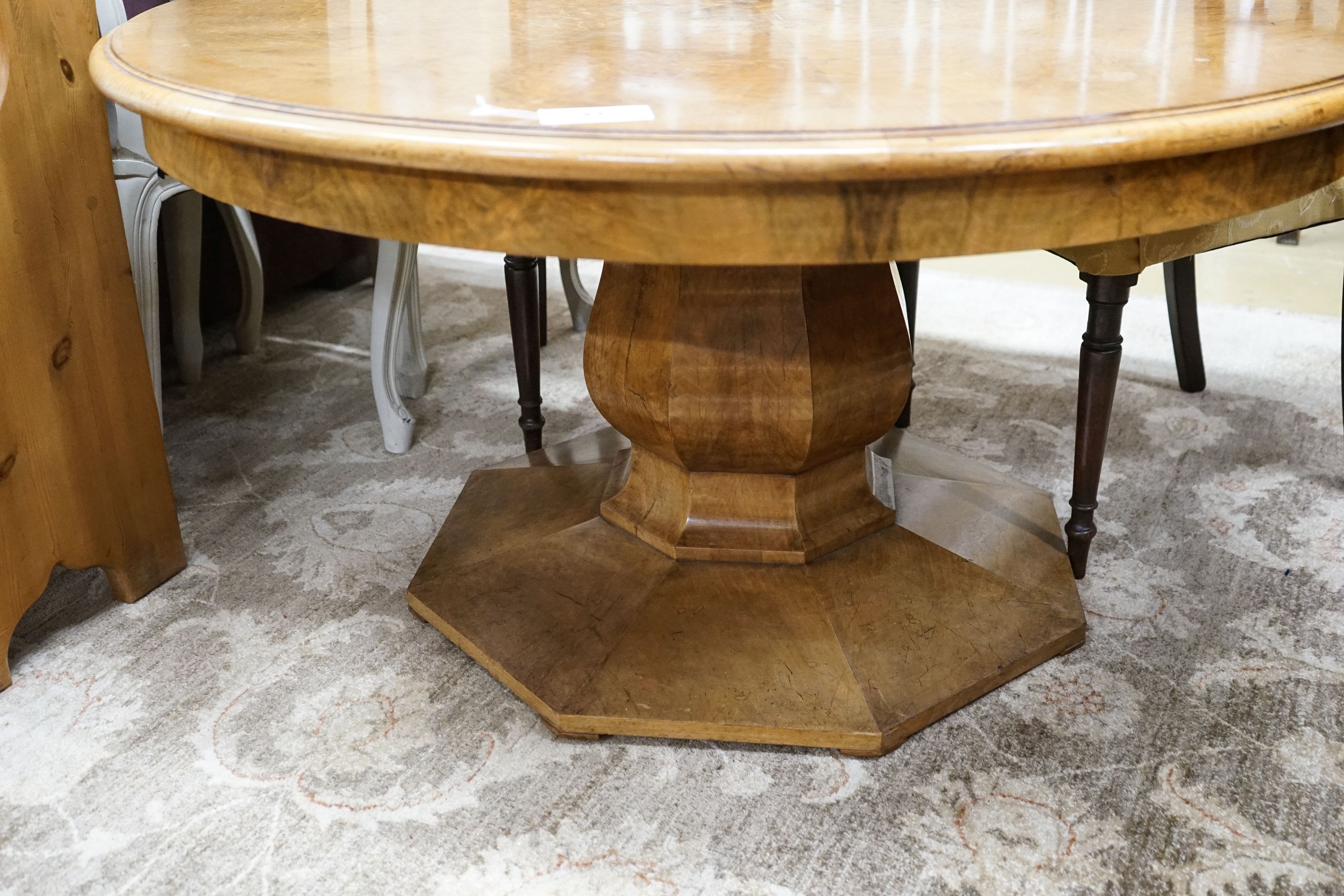 An Art Deco burr walnut circular low table with figured segmented veneered top, diameter 120cm, height 62cm